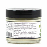 A small jar with a black lid labeled ProMeno Women's Wild Yam Cream, instructing to apply 1/4–1/2 tsp once or twice daily; free from synthetic ingredients, hormones, and fragrances.