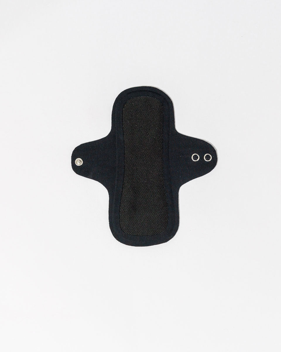 Hello Liners 2 Pack- Fresher Than A Daisy: Reusable black cloth panty liners with wings and metal snaps, ultra thin and machine washable for easy care, displayed flat on a white background.