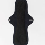 Hello Pads 2 Pack - Overnight Success: reusable black cloth menstrual pads for heavy flow, featuring two metal snaps on the wings, shown laid flat on a white background.