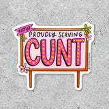 The Now Proudly Serving CUNT Vinyl Sticker features bold, bright lettering with floral details on a light concrete background.
