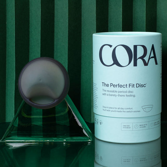 Cora Disc in grey reusable menstrual disc with package