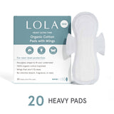 A box of Lola 20ct Ultra Thin Pads w/ Wings, Heavy is shown beside one pad. The packaging highlights leak protection, no dyes, no fragrance, and 100% organic cotton pads.