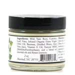 A 2 oz glass jar with a black lid labeled ProMeno Women's Wild Yam Cream, made with natural ingredients like wild yam root, comfrey leaf, olive oil, beeswax, and aloe vera juice.