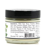 A 2 oz glass jar with a black lid labeled ProMeno Women's Wild Yam Cream, made with natural ingredients like wild yam root, comfrey leaf, olive oil, beeswax, and aloe vera juice.