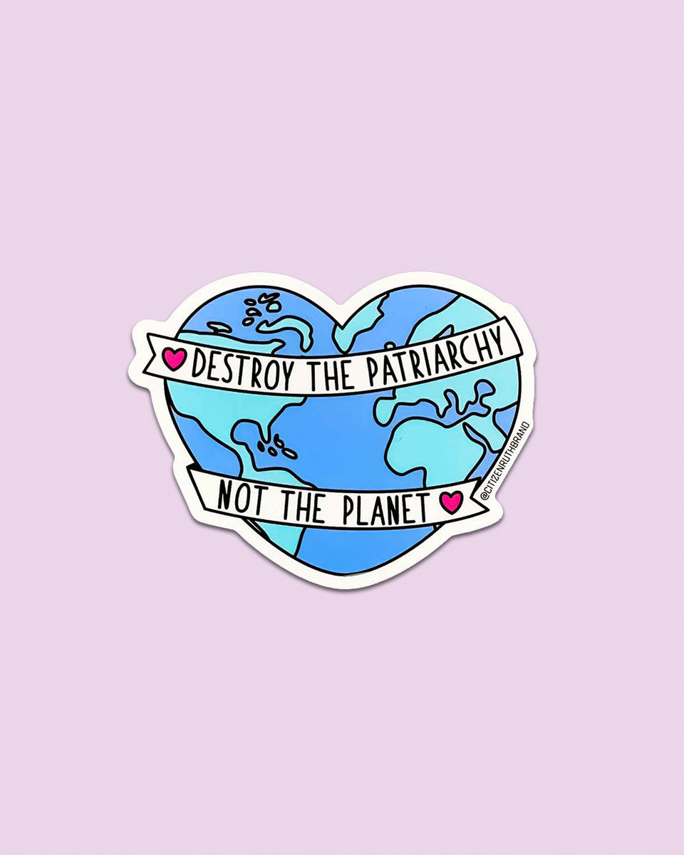 The Destroy the Patriarchy vinyl sticker features a heart-shaped Earth with a white banner reading “Destroy the patriarchy, not the planet,” accented by pink hearts on light purple—an eco-friendly way to make a statement.