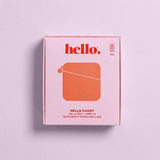 A pink Hello Caddy box with red text reading "hello." and "HELLO CADDY HELLO DISC CARRY & MICROWAVE STERILISER CASE" sits on a light purple background. This case doubles as a period product cleaner and features a simple red graphic design.