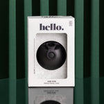 The black Hello Disc Clean on-the-go Bundle is shown in a white box with a clear window, set on a reflective green surface with dark green vertical stripes. Ideal as your menstrual disc starter set.