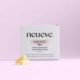 A box of NeuEve Velvet 70+ Suppository is shown against a light pink background, with two yellow suppositories in front, emphasizing its support for pH balance and vaginal health for women experiencing extreme dryness.