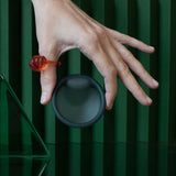 Cora Disc reusable menstrual disc in hand 