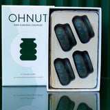 The Ohnut Buffer Rings - Set of 4 features stackable, dark teal, body-safe rings that let couples customize penetration depth for comfort. The box reads: "A friendly buffer to customize penetration depth.